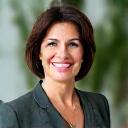 Portrait of Dr. Elena Petrova, a smiling naturopathic doctor.