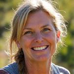 Smiling woman in her late 40s, Sarah L., enjoying the outdoors in Boulder.
