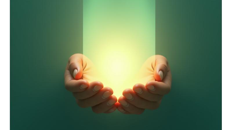 Two hands forming a gentle barrier with a transparent shield, symbolizing protection and clear boundaries in professional wellness coaching